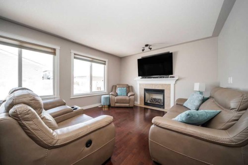 272 Swallow Way, Fort Mcmurray, AB - Indoor Photo Showing Living Room With Fireplace