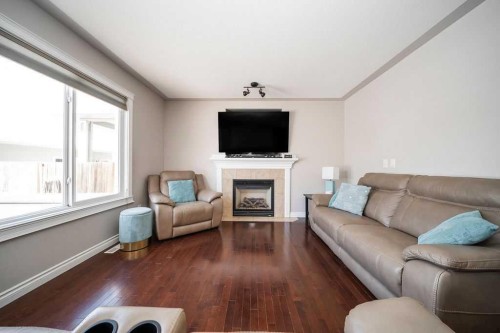 272 Swallow Way, Fort Mcmurray, AB - Indoor Photo Showing Living Room With Fireplace