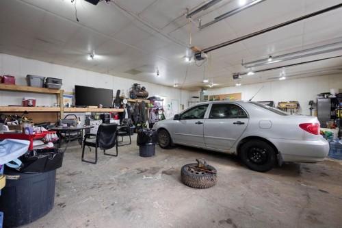 100 Christina Drive, Anzac, AB - Indoor Photo Showing Garage