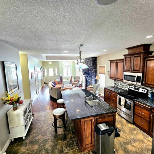 307 Highland Way, Lac La Biche, AB - Indoor Photo Showing Kitchen With Double Sink