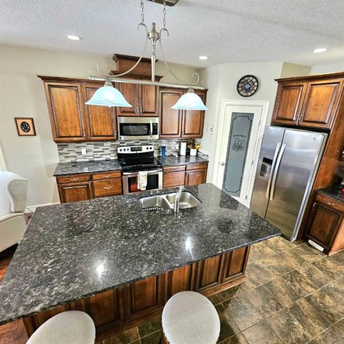 307 Highland Way, Lac La Biche, AB - Indoor Photo Showing Kitchen With Double Sink