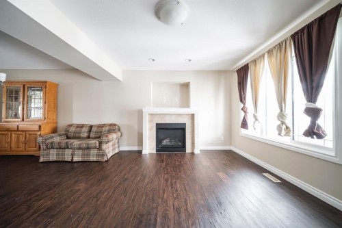240 Comeau Crescent, Fort Mcmurray, AB - Indoor Photo Showing Living Room With Fireplace