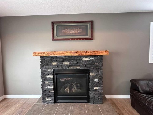 9632 100 Avenue, Lac La Biche, AB - Indoor Photo Showing Living Room With Fireplace