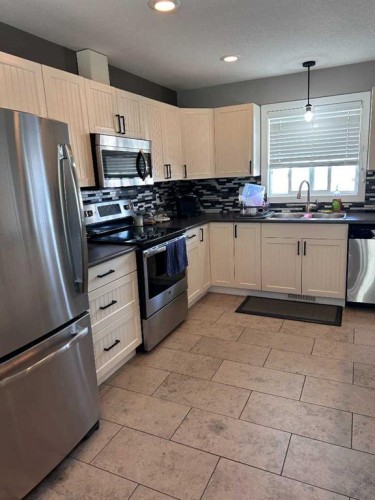 9632 100 Avenue, Lac La Biche, AB - Indoor Photo Showing Kitchen With Double Sink