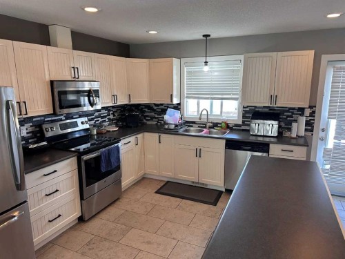 9632 100 Avenue, Lac La Biche, AB - Indoor Photo Showing Kitchen With Double Sink