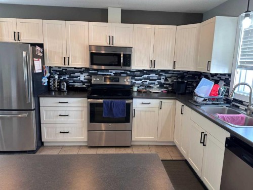 9632 100 Avenue, Lac La Biche, AB - Indoor Photo Showing Kitchen With Double Sink