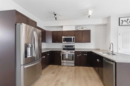 253 Grosbeak Way, Fort Mcmurray, AB - Indoor Photo Showing Kitchen With Double Sink