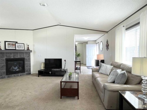 145 Caouette Crest, Fort Mcmurray, AB - Indoor Photo Showing Living Room With Fireplace