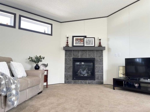 145 Caouette Crest, Fort Mcmurray, AB - Indoor Photo Showing Living Room With Fireplace
