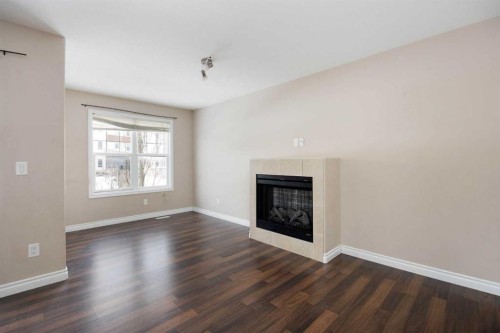 55-180 Riverstone Ridge, Fort Mcmurray, AB - Indoor Photo Showing Living Room With Fireplace