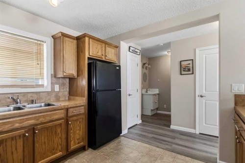 93-313 Millennium Drive, Fort Mcmurray, AB - Indoor Photo Showing Kitchen With Double Sink
