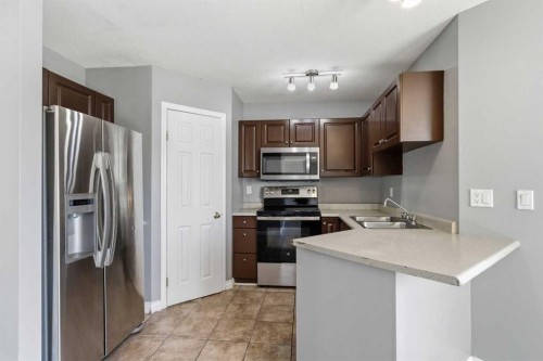 228 Parry Crescent, Fort Mcmurray, AB - Indoor Photo Showing Kitchen With Stainless Steel Kitchen With Double Sink
