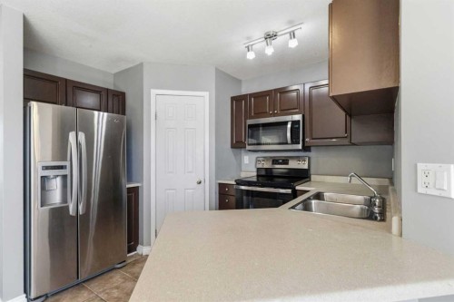 228 Parry Crescent, Fort Mcmurray, AB - Indoor Photo Showing Kitchen With Stainless Steel Kitchen With Double Sink