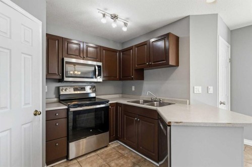 228 Parry Crescent, Fort Mcmurray, AB - Indoor Photo Showing Kitchen With Stainless Steel Kitchen With Double Sink