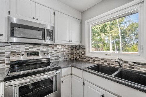 7 May Crescent, Fort Mcmurray, AB - Indoor Photo Showing Kitchen With Double Sink