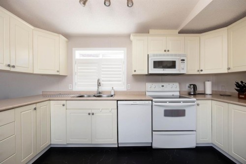 144 Mitchell Drive, Fort Mcmurray, AB - Indoor Photo Showing Kitchen With Double Sink