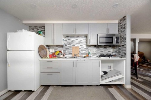 112 Hill Drive, Fort Mcmurray, AB - Indoor Photo Showing Kitchen With Double Sink