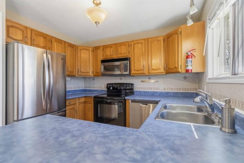 307 Cornwall Drive, Fort Mcmurray, AB - Indoor Photo Showing Kitchen With Stainless Steel Kitchen With Double Sink