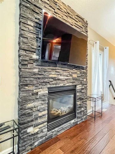 260 Killdeer Way, Fort Mcmurray, AB - Indoor Photo Showing Living Room With Fireplace