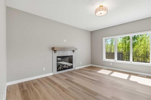 241 Warren Way, Fort Mcmurray, AB - Indoor Photo Showing Living Room With Fireplace