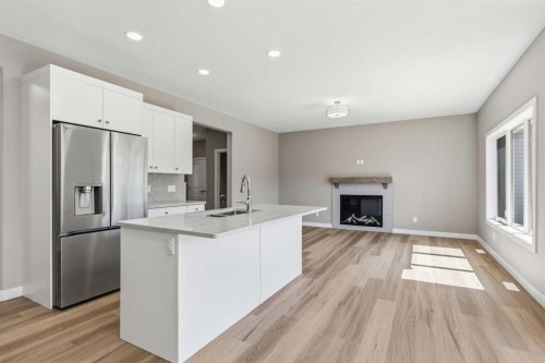 241 Warren Way, Fort Mcmurray, AB - Indoor Photo Showing Kitchen With Fireplace