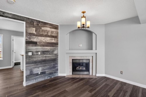 108 Kodiak Crescent, Fort Mcmurray, AB - Indoor Photo Showing Living Room With Fireplace