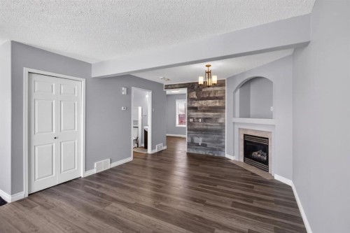 108 Kodiak Crescent, Fort Mcmurray, AB - Indoor Photo Showing Living Room With Fireplace