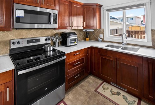 128 Juniper Street, Fort Mcmurray, AB - Indoor Photo Showing Kitchen With Double Sink