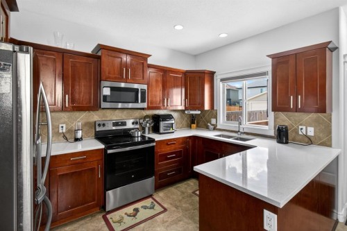 128 Juniper Street, Fort Mcmurray, AB - Indoor Photo Showing Kitchen With Double Sink