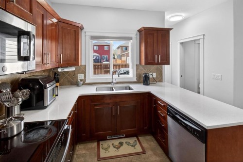 128 Juniper Street, Fort Mcmurray, AB - Indoor Photo Showing Kitchen With Double Sink