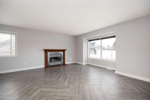233 Bacon Place, Fort Mcmurray, AB - Indoor Photo Showing Living Room With Fireplace