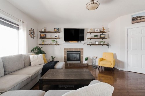 128 Coyote Crescent, Fort Mcmurray, AB - Indoor Photo Showing Living Room With Fireplace