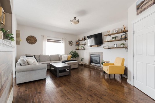 128 Coyote Crescent, Fort Mcmurray, AB - Indoor Photo Showing Living Room With Fireplace