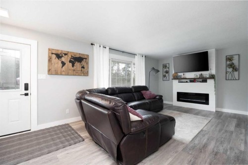 149 Ermine Crescent, Fort Mcmurray, AB - Indoor Photo Showing Living Room With Fireplace