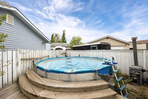 147 Cree Lane, Fort Mcmurray, AB - Outdoor With Above Ground Pool With Deck Patio Veranda
