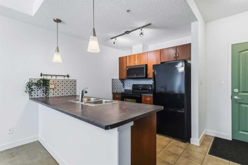 108-136B Sandpiper Road, Fort Mcmurray, AB - Indoor Photo Showing Kitchen With Double Sink