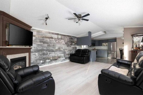 120 Hunter Street, Fort Mcmurray, AB - Indoor Photo Showing Living Room With Fireplace