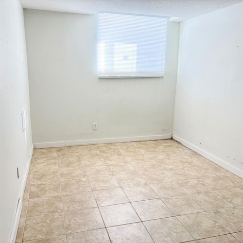 83 Aspen Crescent, Gregoire Lake Estates, AB - Indoor Photo Showing Other Room
