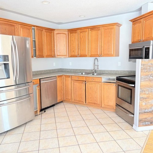 83 Aspen Crescent, Gregoire Lake Estates, AB - Indoor Photo Showing Kitchen With Double Sink