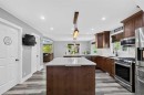 102 Gregoire Drive, Anzac, AB  - Indoor Photo Showing Kitchen With Stainless Steel Kitchen With Upgraded Kitchen 