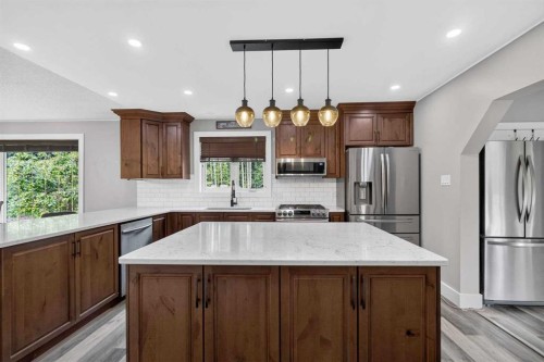 102 Gregoire Drive, Anzac, AB - Indoor Photo Showing Kitchen With Stainless Steel Kitchen With Upgraded Kitchen