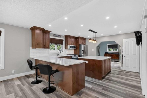102 Gregoire Drive, Anzac, AB - Indoor Photo Showing Kitchen With Stainless Steel Kitchen With Upgraded Kitchen