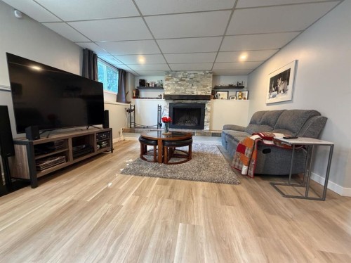 505 12 Avenue, Slave Lake, AB - Indoor Photo Showing Living Room With Fireplace