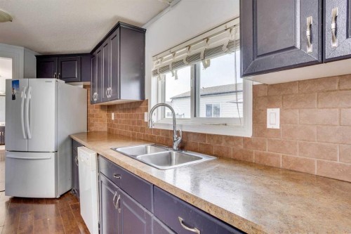 180 Cokerill Crescent, Fort Mcmurray, AB - Indoor Photo Showing Kitchen With Double Sink