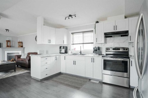 161 Harpe Way, Fort Mcmurray, AB - Indoor Photo Showing Kitchen With Fireplace