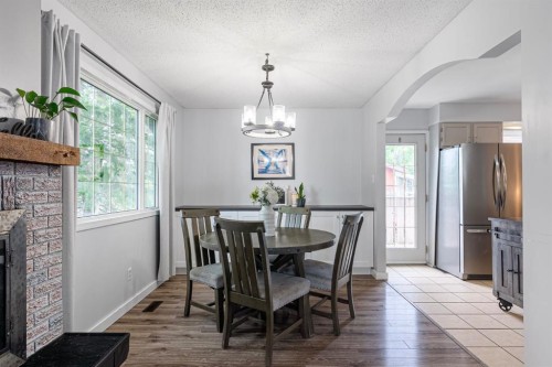 120 Dowd Road, Fort Mcmurray, AB - Indoor Photo Showing Dining Room With Fireplace