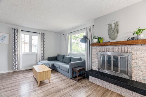 120 Dowd Road, Fort Mcmurray, AB - Indoor Photo Showing Living Room With Fireplace