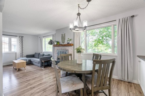 120 Dowd Road, Fort Mcmurray, AB - Indoor Photo Showing Dining Room With Fireplace