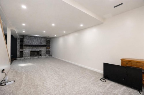 222 Berens Place, Fort Mcmurray, AB - Indoor Photo Showing Other Room With Fireplace