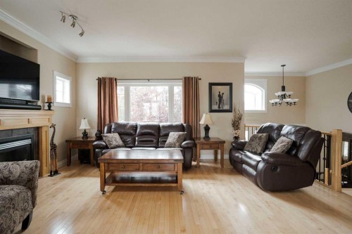 128 Dogwood Lane, Fort Mcmurray, AB - Indoor Photo Showing Living Room With Fireplace